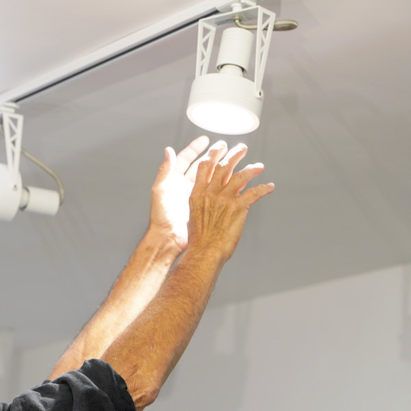 hands reaching for light